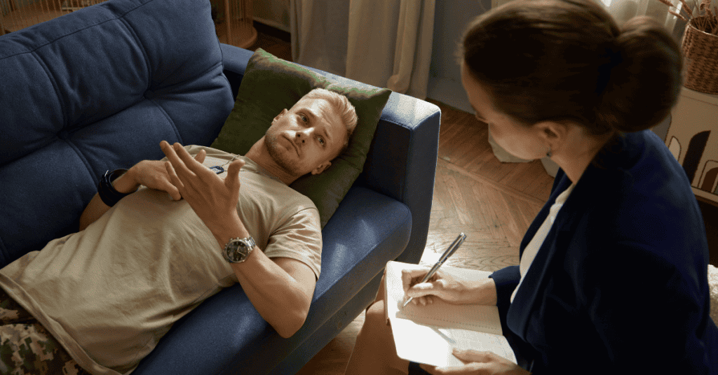 Man lying on a couch during a therapy session