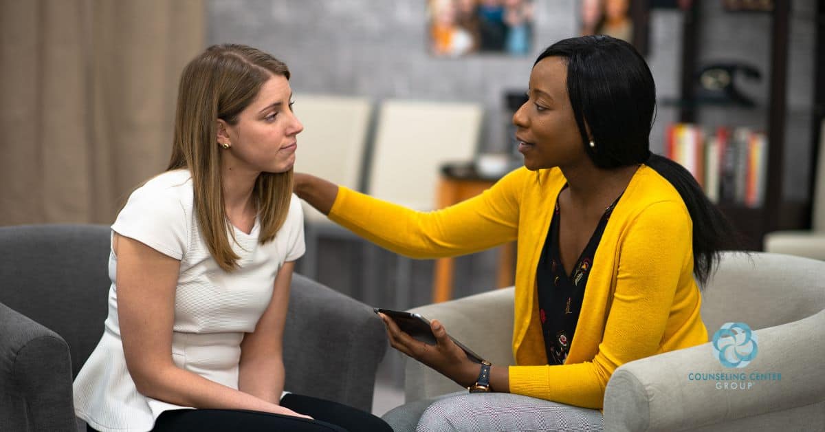 A therapist and client discussing trauma recovery options like ART