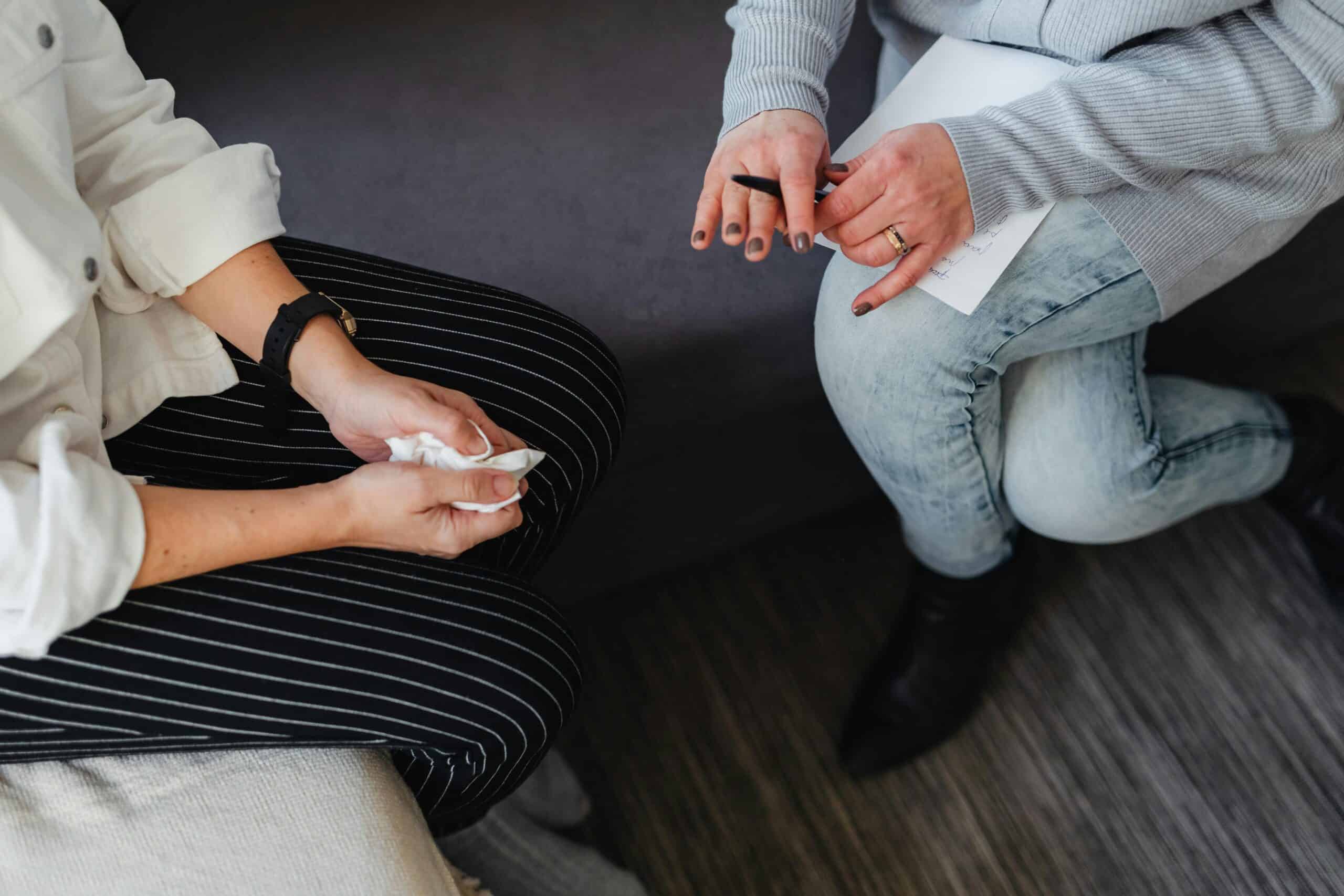 A client and therapist discussing the problems best treated in therapy